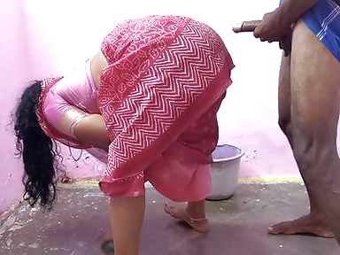 Aunty is cleaning the floor when a young boy has sex with her